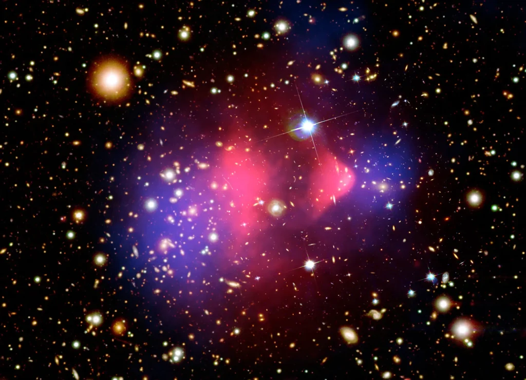 Bullet Cluster showing separated hot gas and dark matter distributions after a galaxy cluster collision
